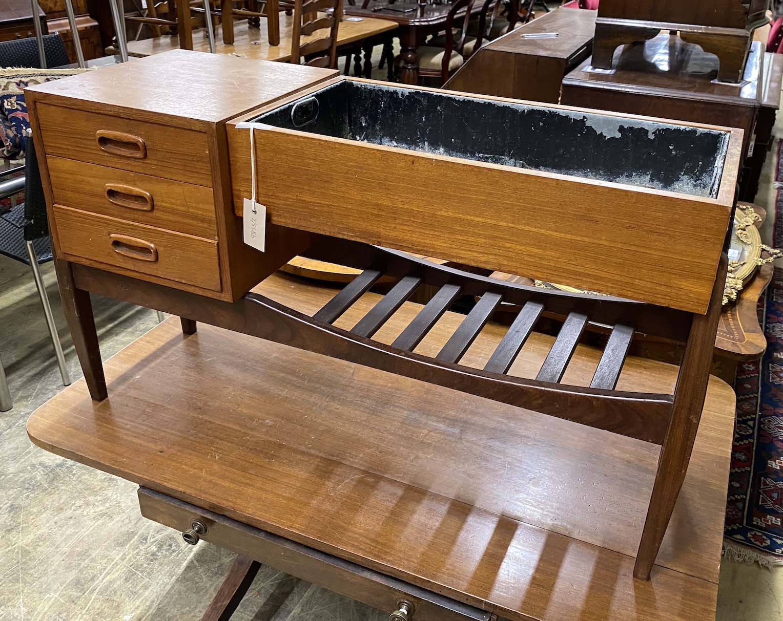 A mid century teak jardiniere table, width 99cm, depth 30cm, height 55cm